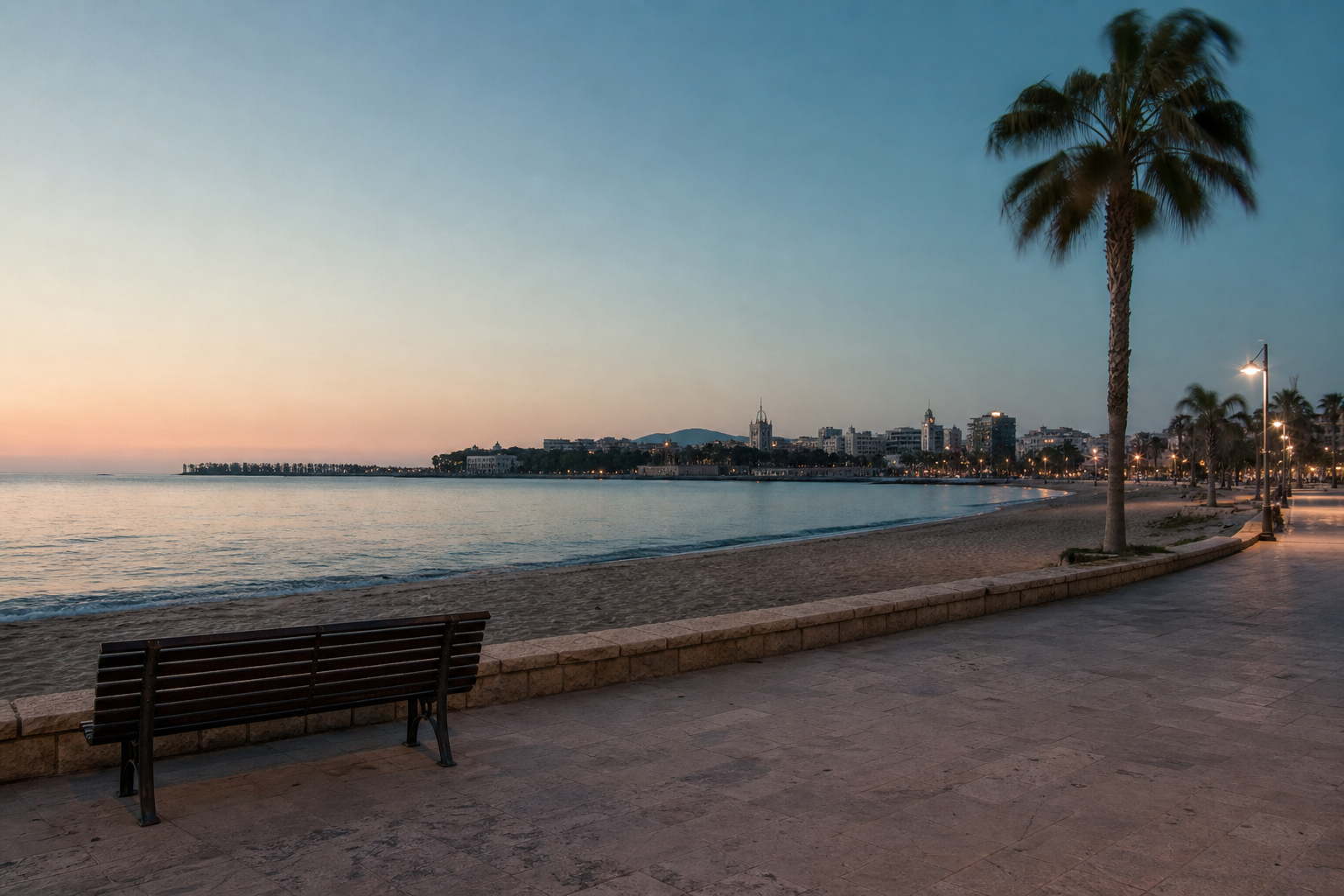 A calm Málaga promenade and beach at blue hour